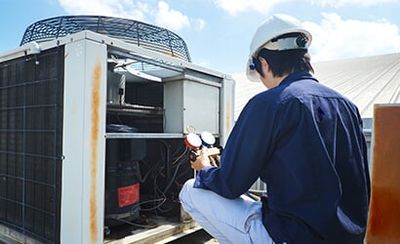 Man Testing MAchine - Heating And Air Conditioning In Belle Haven, VA