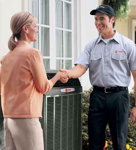 A Employee and a Woman Shaking Hands — Belle Haven, VA — Thornton Services Inc.