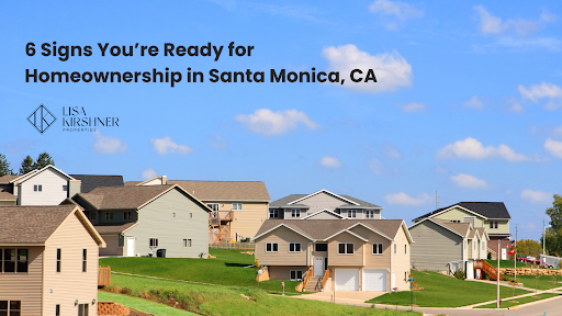 A suburban neighborhood with modern two-story houses on a sunny day under a clear blue sky with a few clouds.