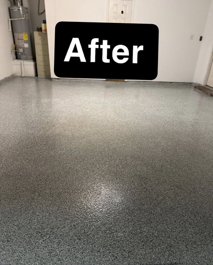 A garage floor with a smooth, glossy gray epoxy finish featuring a speckled, multi-tone gray and white texture.