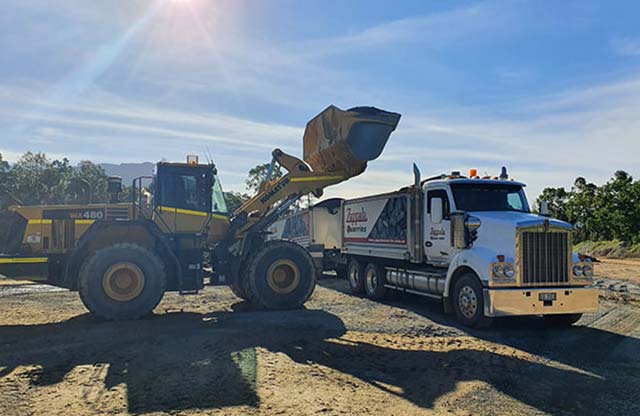Construction Truck Dumping Gravel On Road Construction Site — Zappala Quarries In Atherton