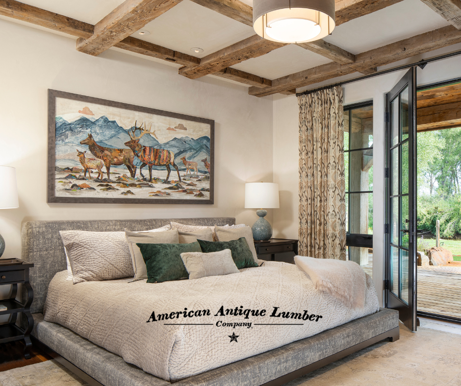 Bed with white bedding and green pillow with open French door on the right and Elk artwork above the bed. 