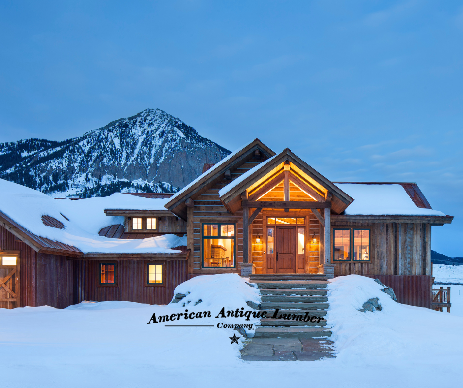 Large stone steps leading to front door surrounded by snow with Mt. Crested Butte covered in snow behind. 