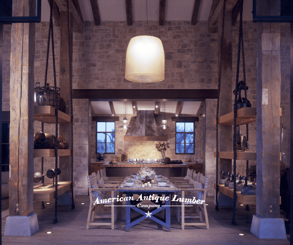Oversized white hanging light over a dining room table flanked by reclaimed hand hewn timbers with stone walls. 