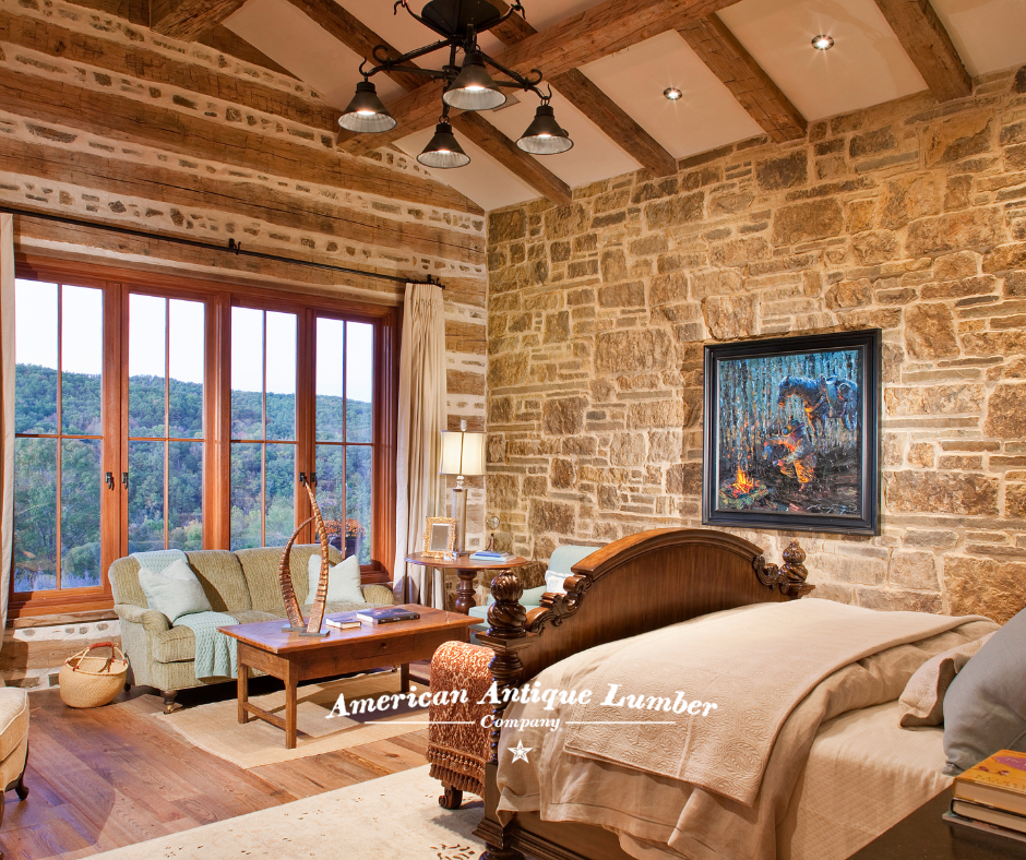 Stone wall and hand hewn wall with stone and mortar chinking in a bedroom with windows overlooking the Arkansas mountains. 