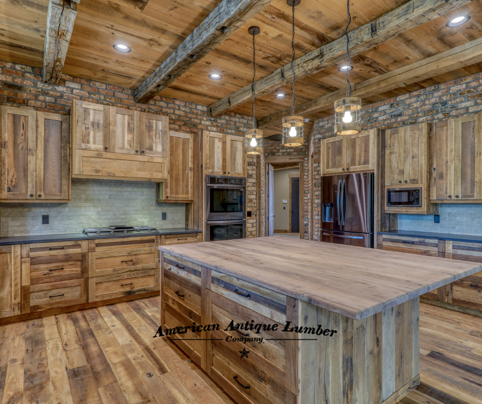 Reclaimed wood kitchen center island with brick backsplash and brick above the cabinets. Stainless steel double oven, fridge and microwave.