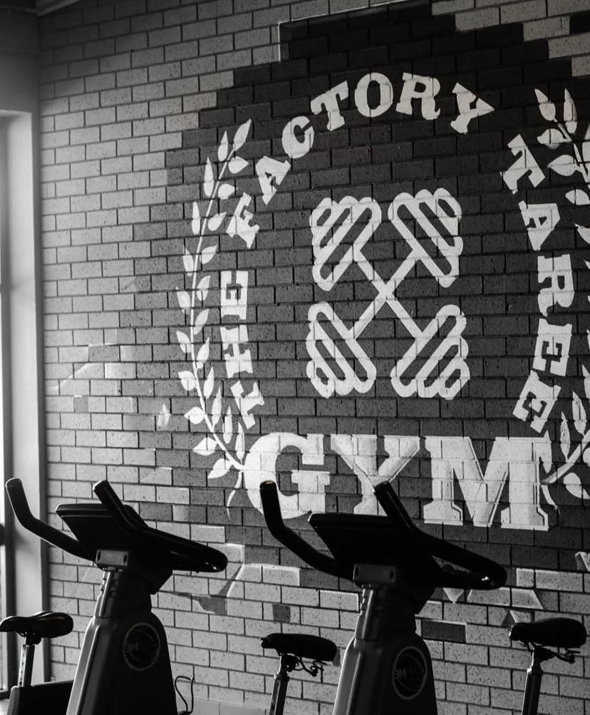 A Black and White Photo of Exercise Bikes in a Gym — The Factory Gym in Taree, NSW