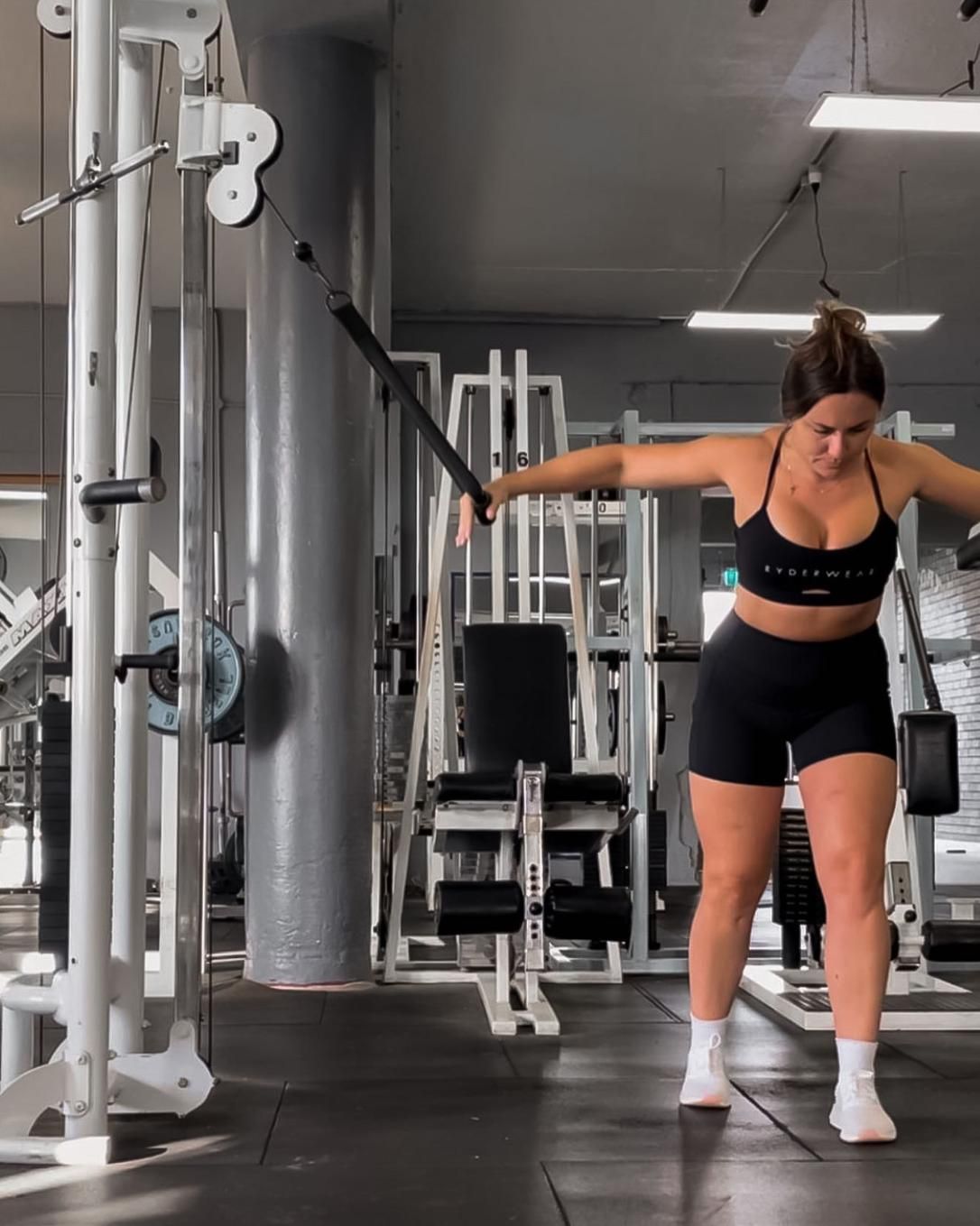 A Woman is Using a Machine in a Gym — The Factory Gym in Taree, NSW