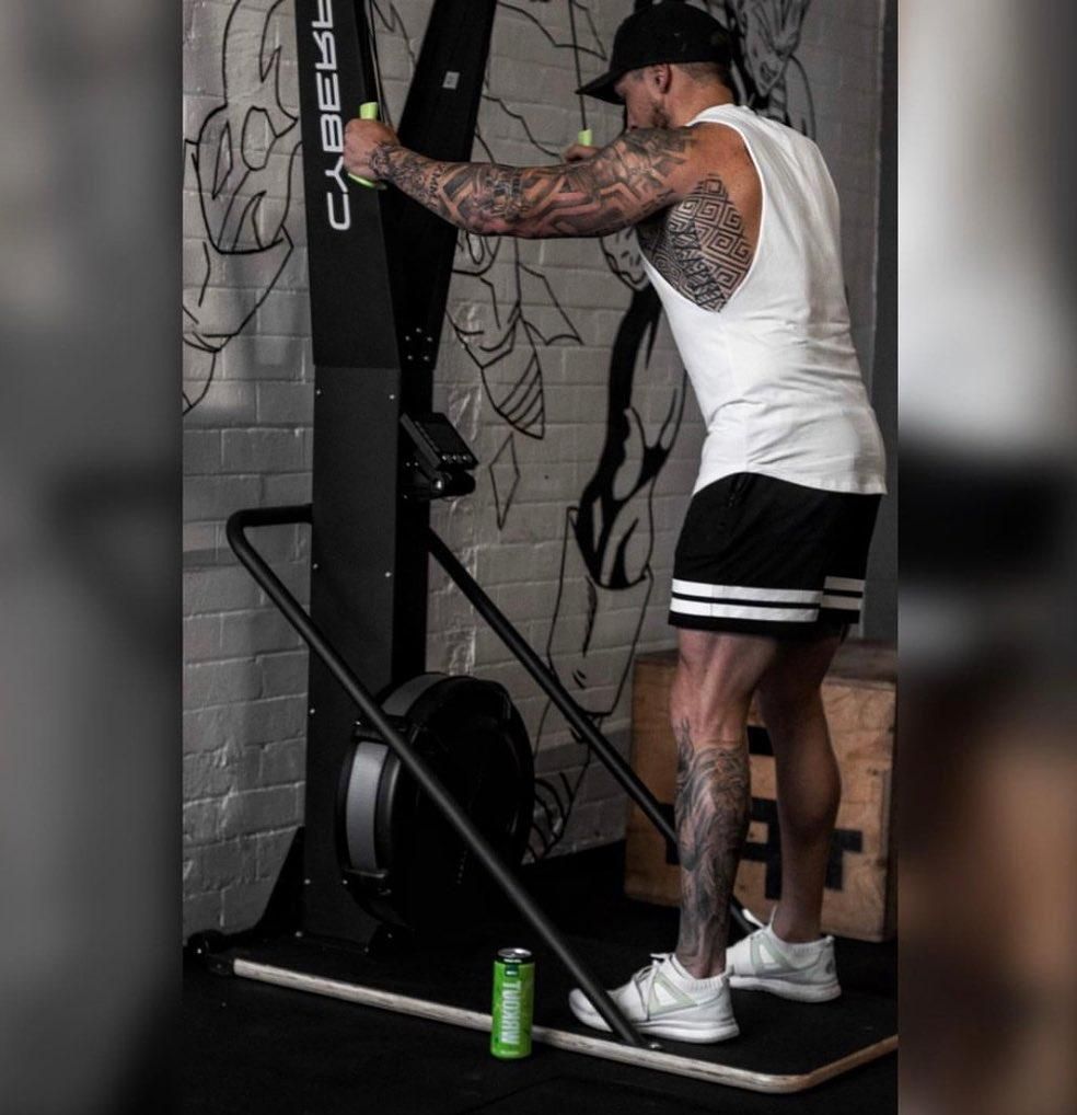 A Man is Standing in Front of a Machine in a Gym — The Factory Gym in Taree, NSW
