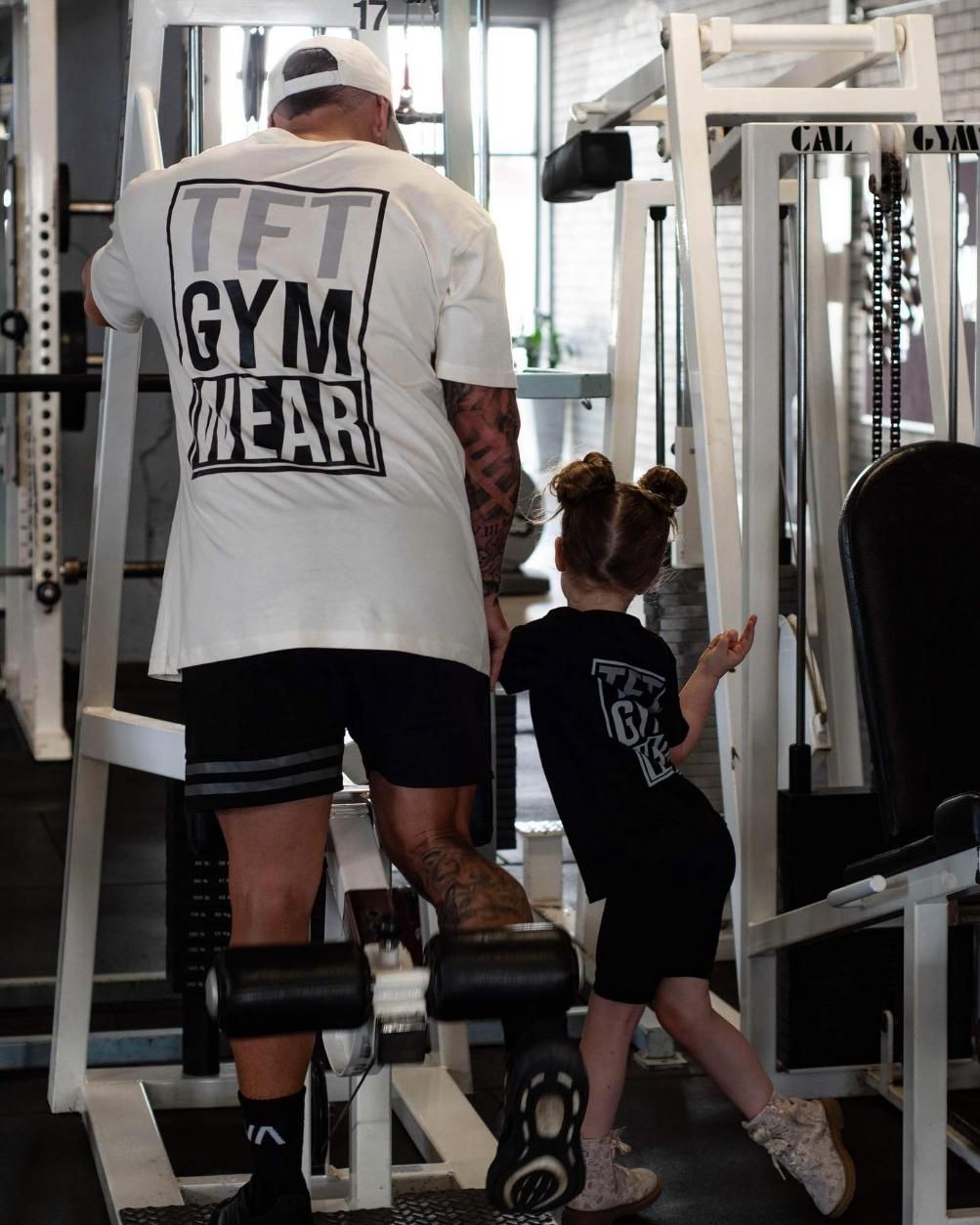 A Man and a Little Girl Are in a Gym — The Factory Gym in Taree, NSW