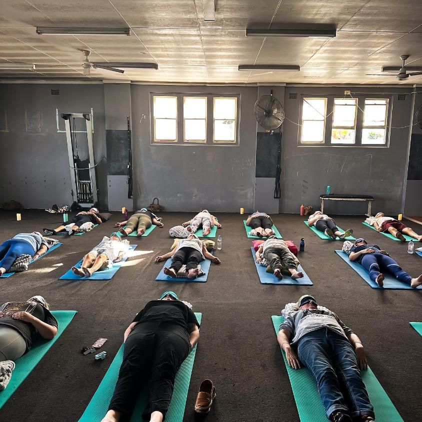 A Group of People With Sleeping Mask Laying On A Gym — The Factory Gym in Taree, NSW