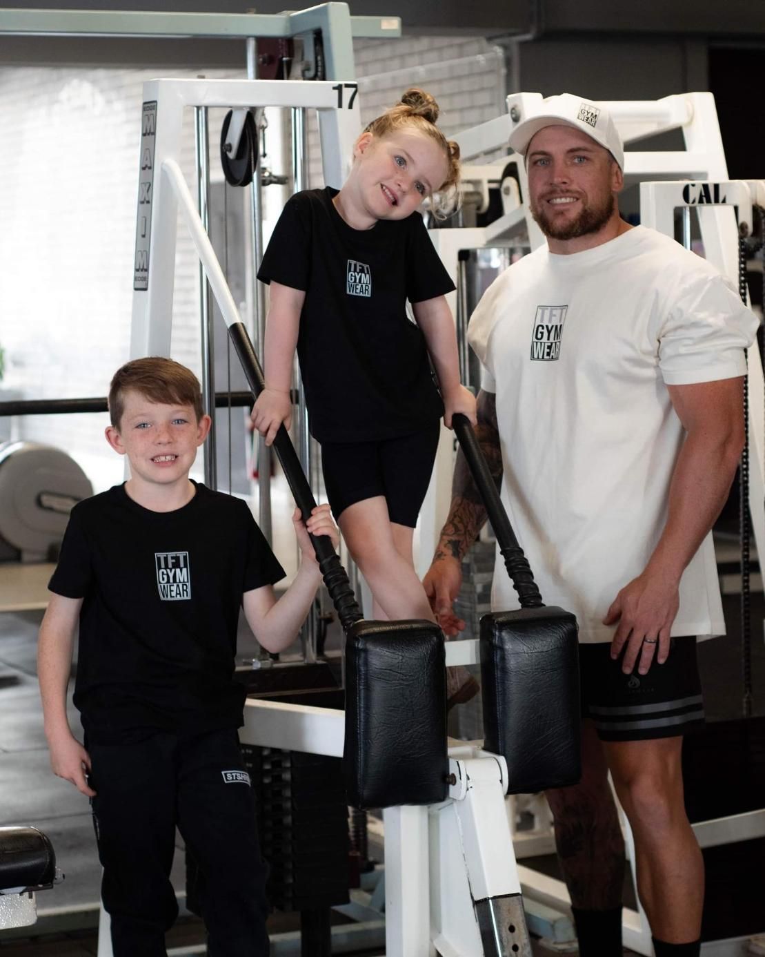 A Man and Two Children Are Posing for a Picture in a Gym — The Factory Gym in Taree, NSW