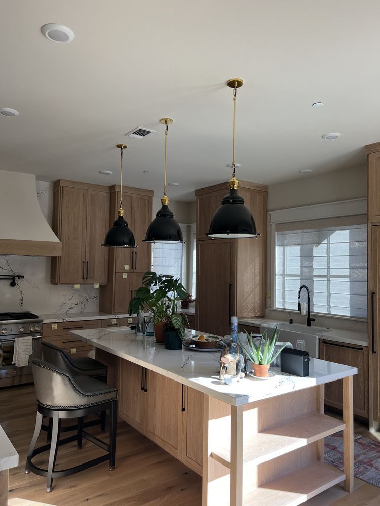 There is a large island in the middle of the kitchen.
