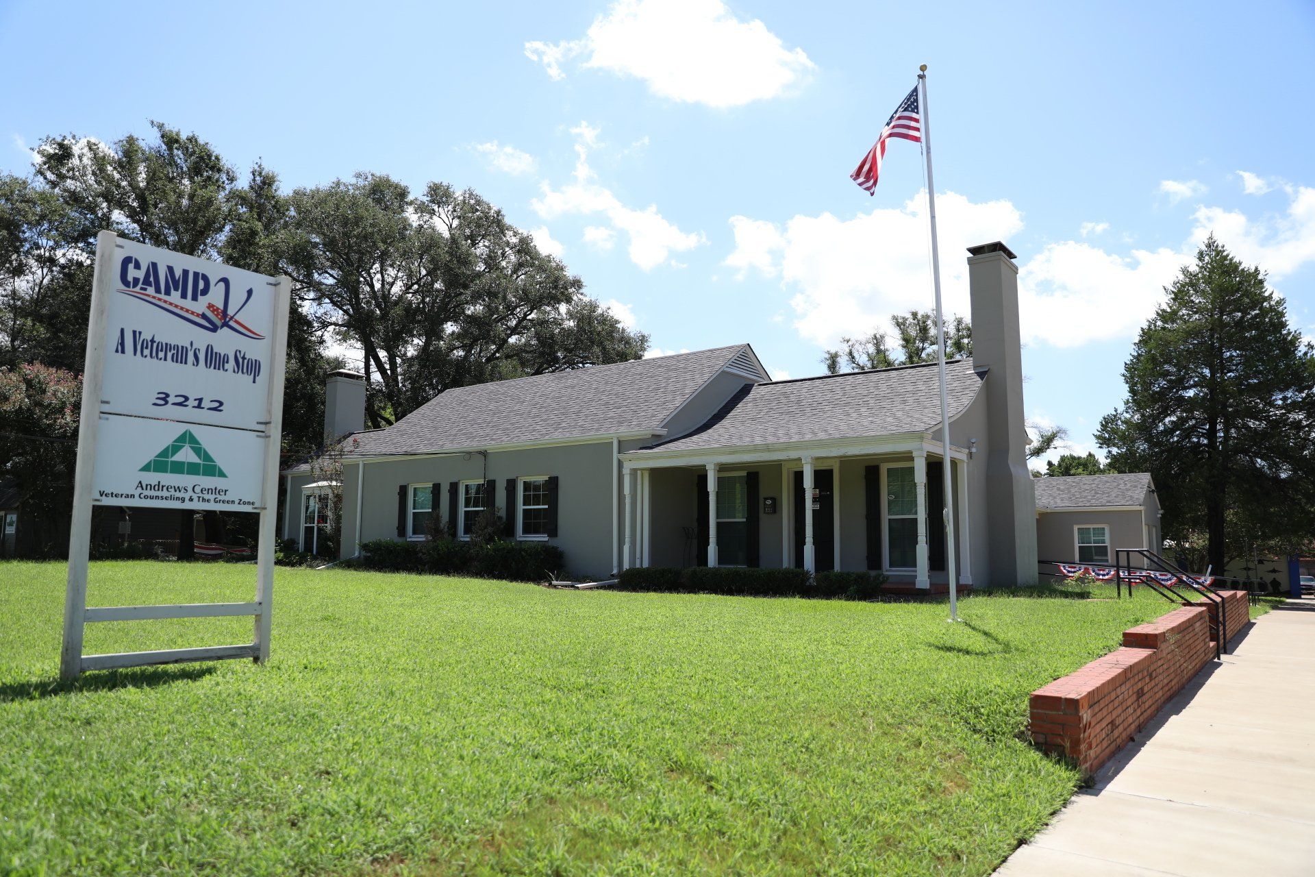A house with a sign in front of it that says camp 1