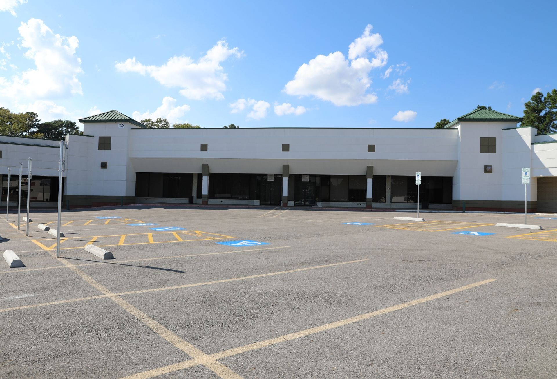 white building with a blue cloudy sky