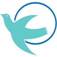 A blue bird is flying in a blue circle.