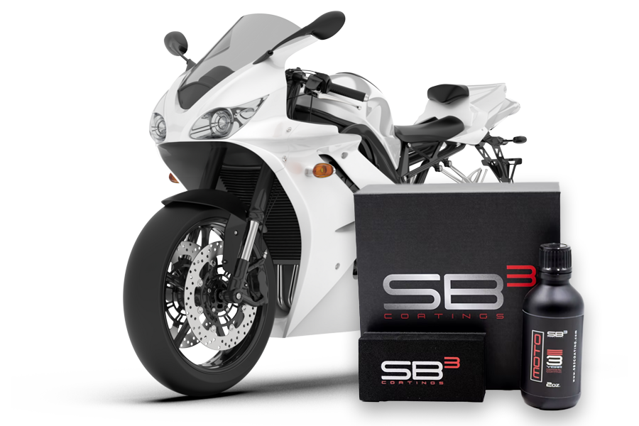 A white motorcycle is sitting next to a box that says sb3