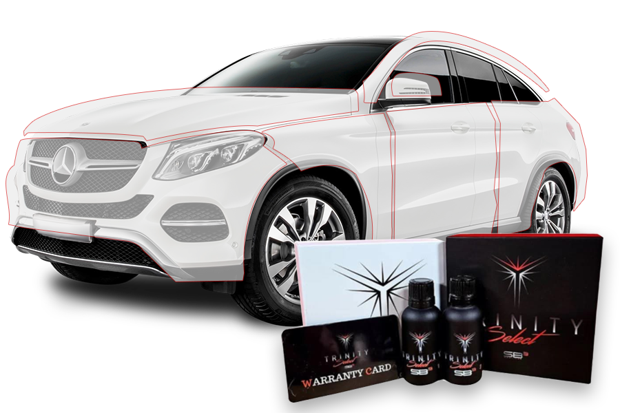 A white mercedes gle with a warranty card , bottles , and a box.