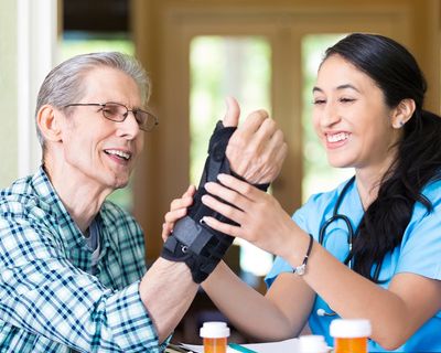 Nurse Examines Senior Patient's Wrist — Mason, OH — Distinguished Orthopedic Home Care