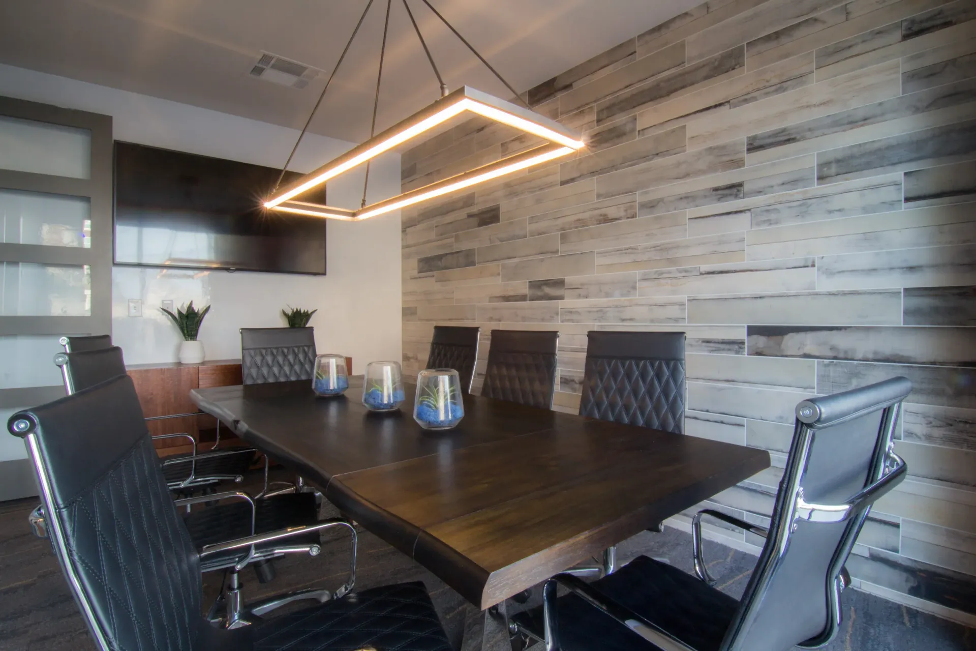 Red and orange sandstone canyon walls, with light at the top.