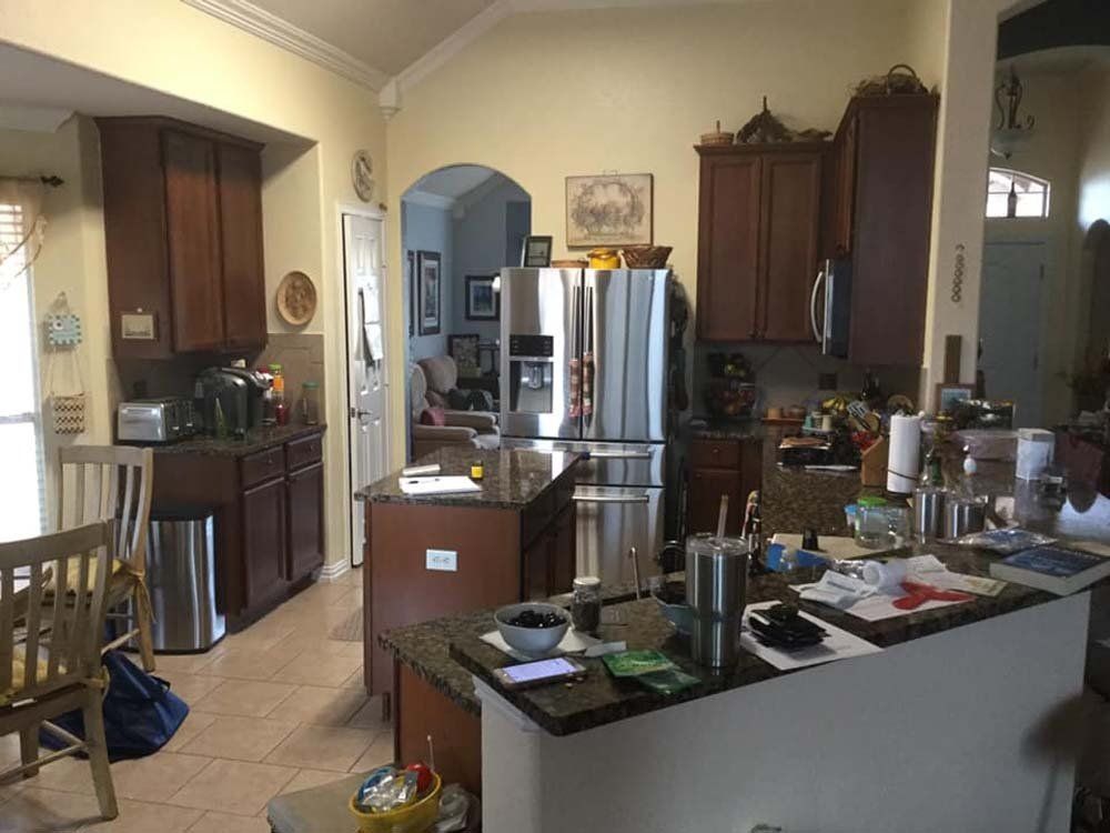 A kitchen with stainless steel appliances and wooden cabinets