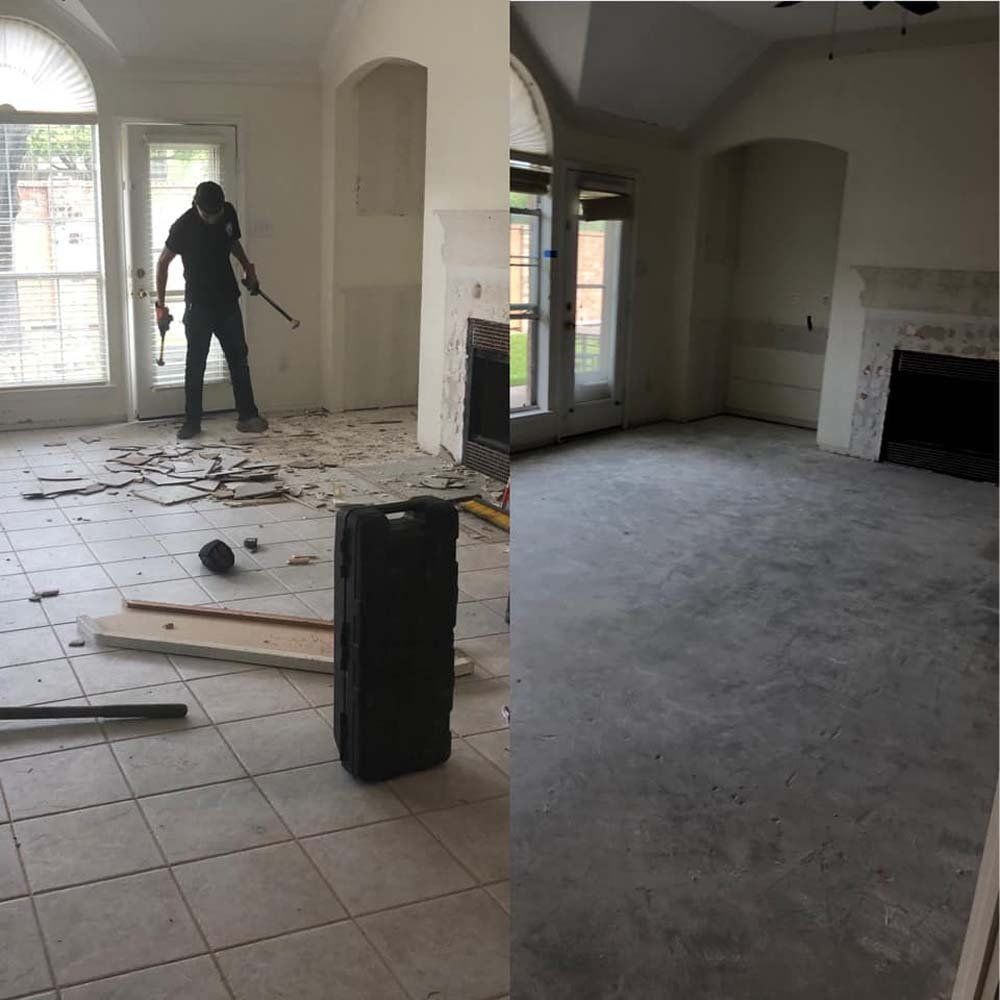 A man is standing in a room next to a fireplace