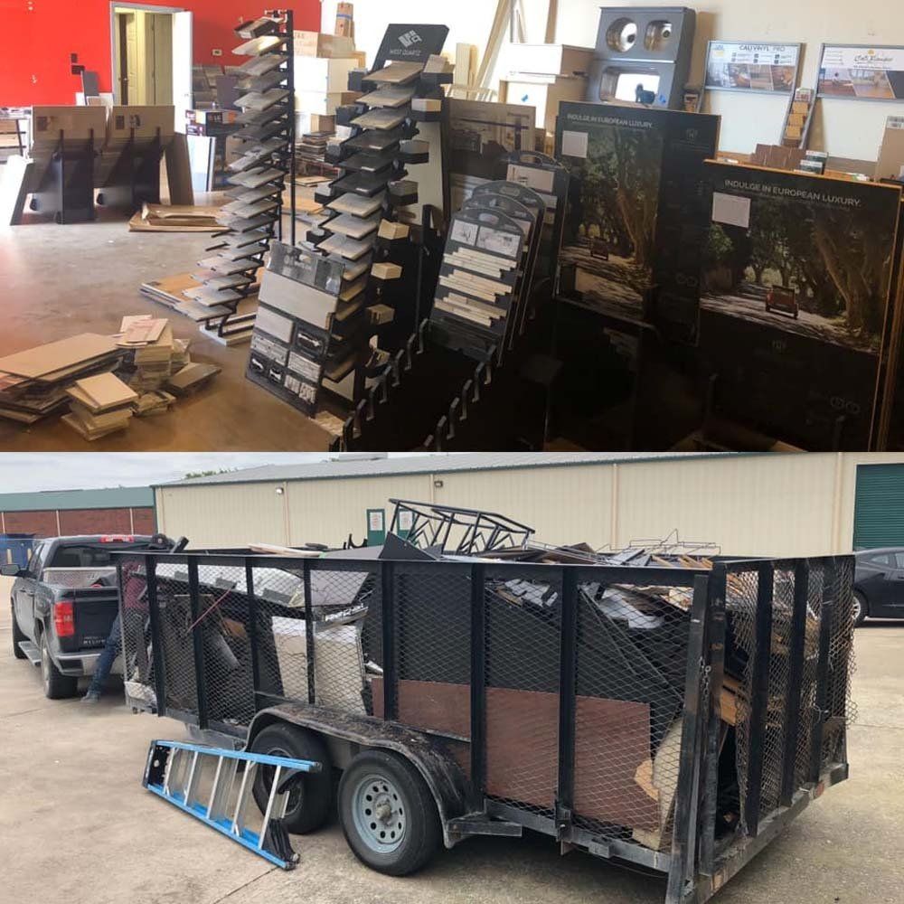 A trailer with a ladder attached to it is parked in front of a store