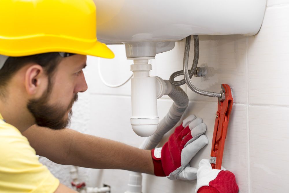 Plumber Fixing Sink Pipe — Your Local Plumber in Tamworth, NSW