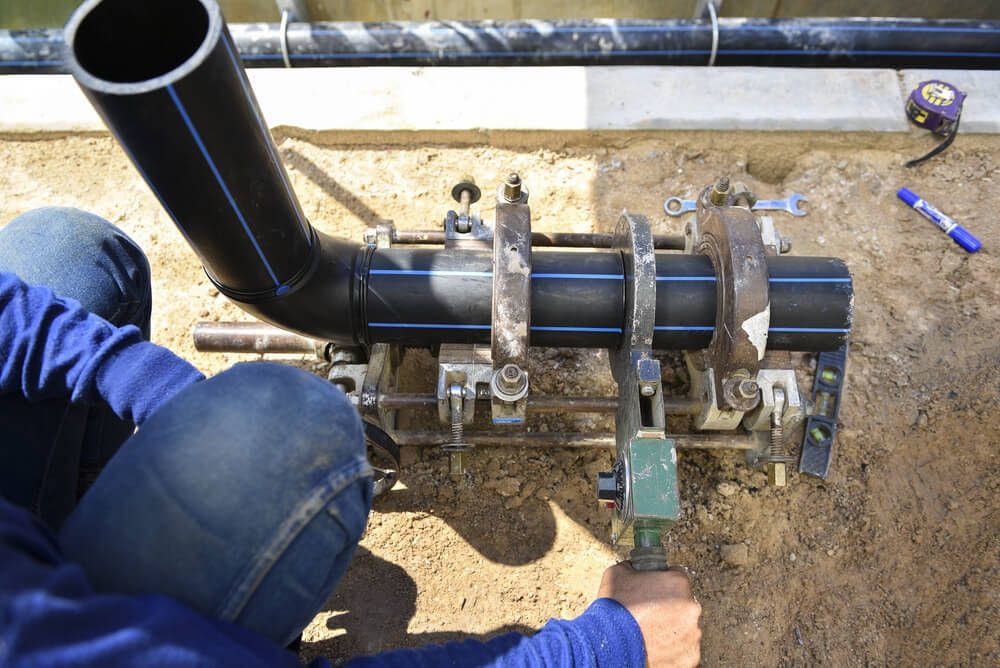 Plumber Clamping Pipes — Your Local Plumber in Tamworth, NSW