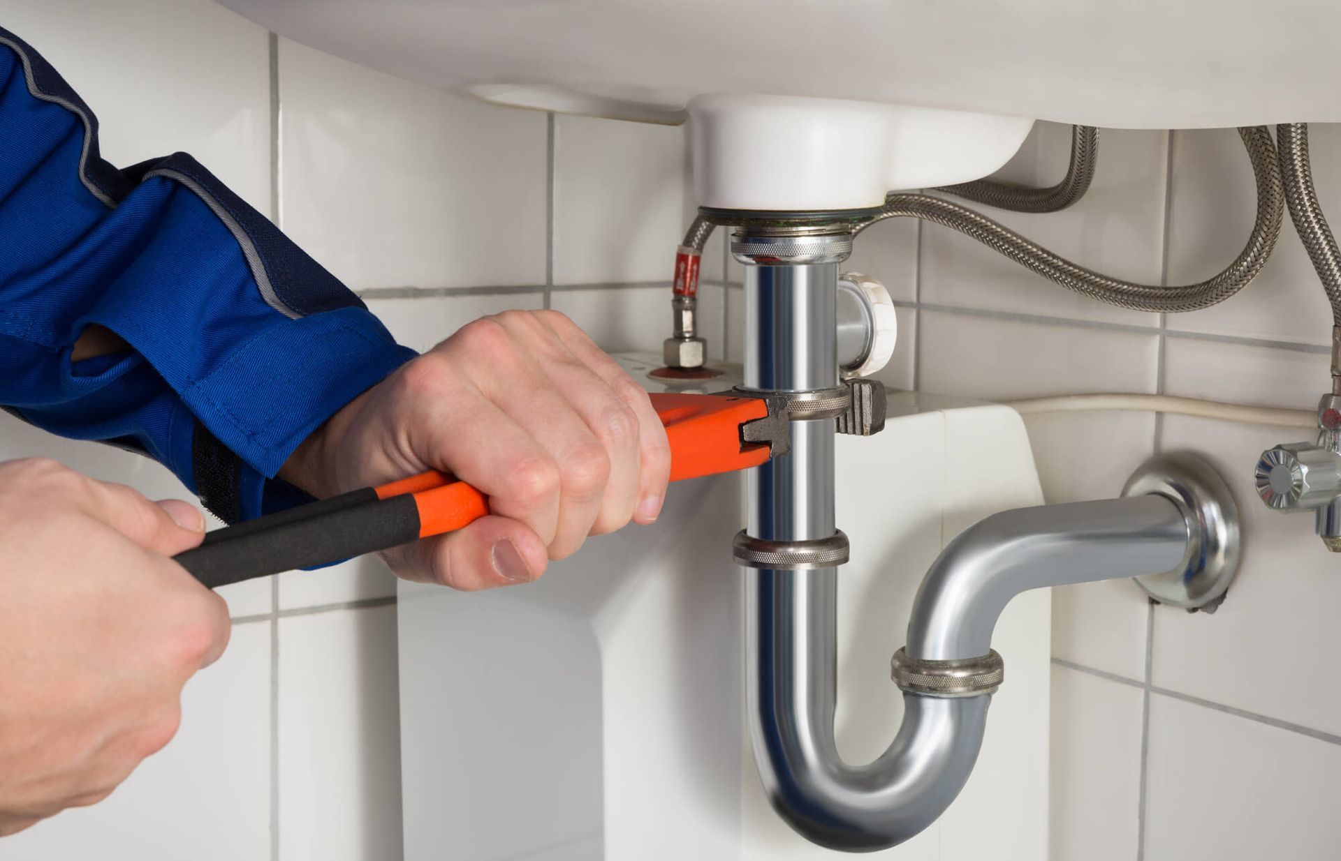Plumber Fixing The Pipes — Your Local Plumber in Tamworth, NSW