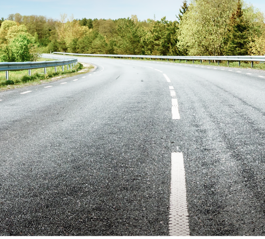 A road with a white line on the middle of it | Peakes Auto Repair