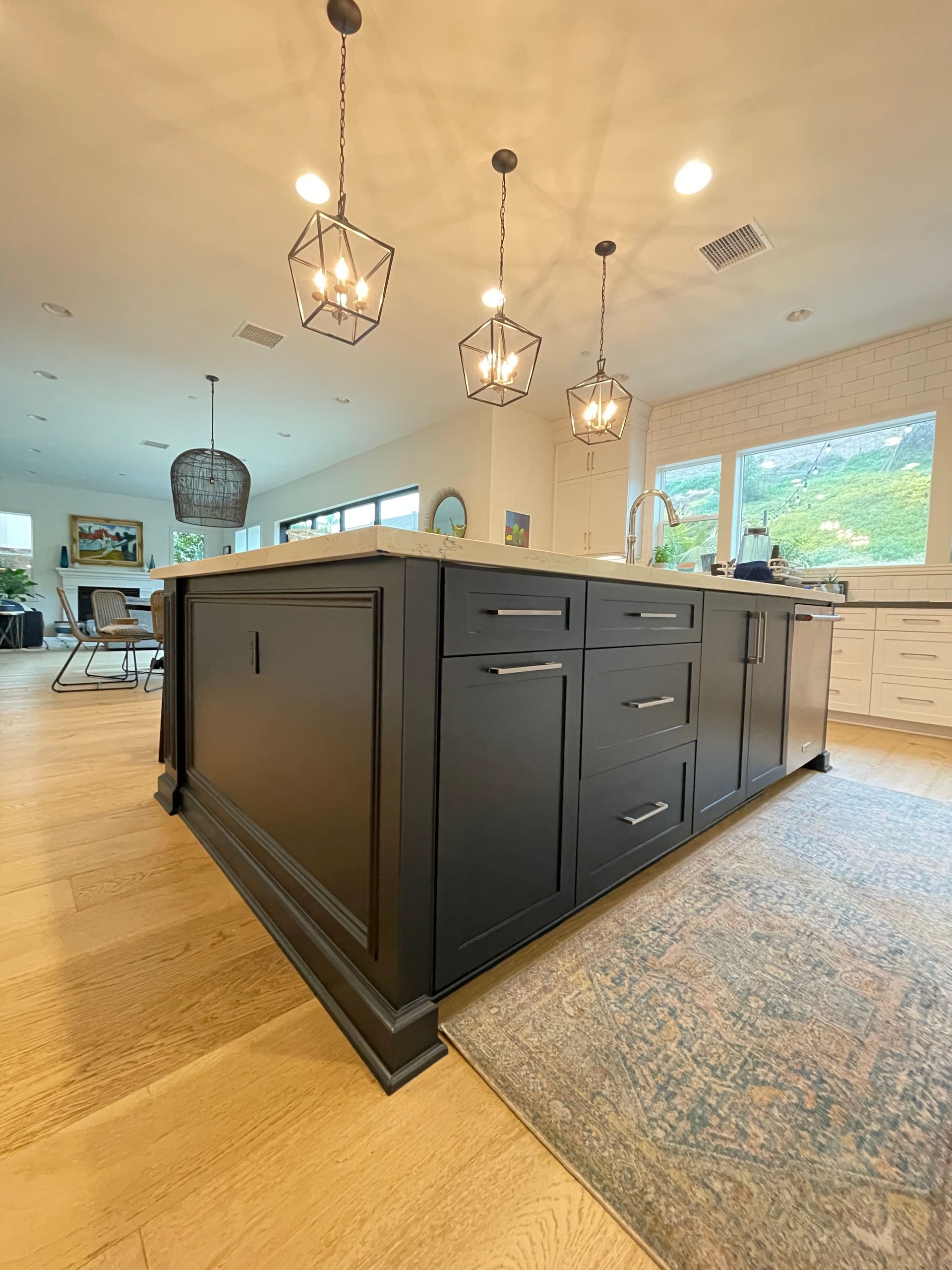 a kitchen with a large island in the middle of the room .