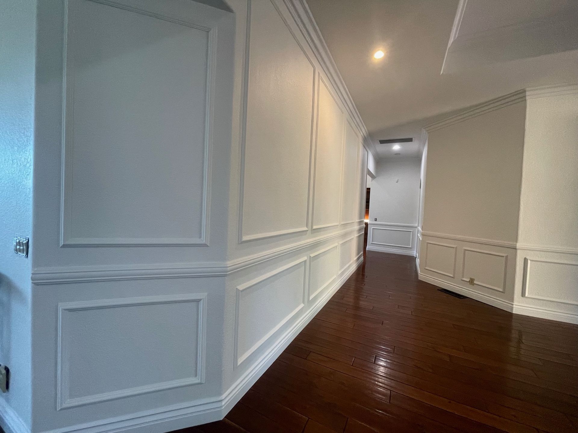 Trim work accents, install and painted. white modern and stylish interiors in this estate in Escondido CA.