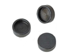 Three Black Rubber Caps Are Sitting Next To Each Other On A White Background — Warren, MI — Howard's Outdoor Power Equipment