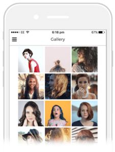 A cell phone displaying a gallery of women 's faces