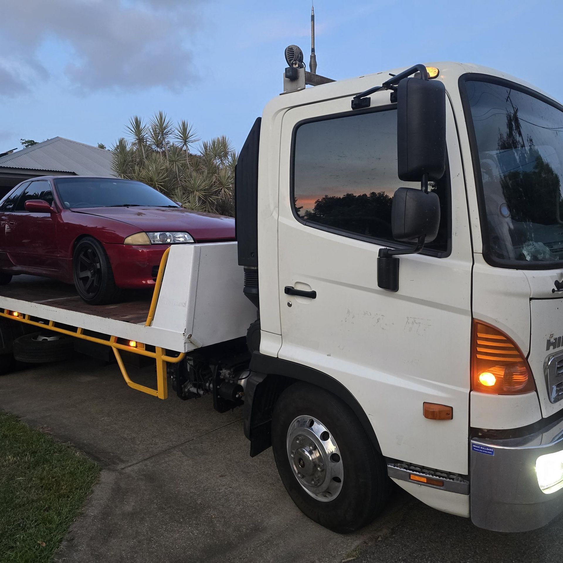 Gray Suv Being Towed by a Tow Truck on a Road — Old Mate's Towing Townsville in Deeragun, QLD