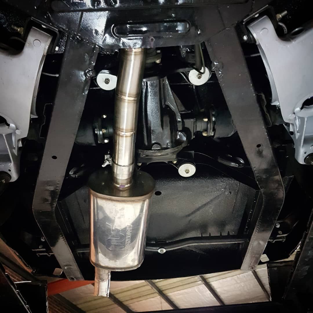 A Close Up Of The Underside Of A Car With A Exhaust Pipe - Mechanic In Fyshwick, ACT