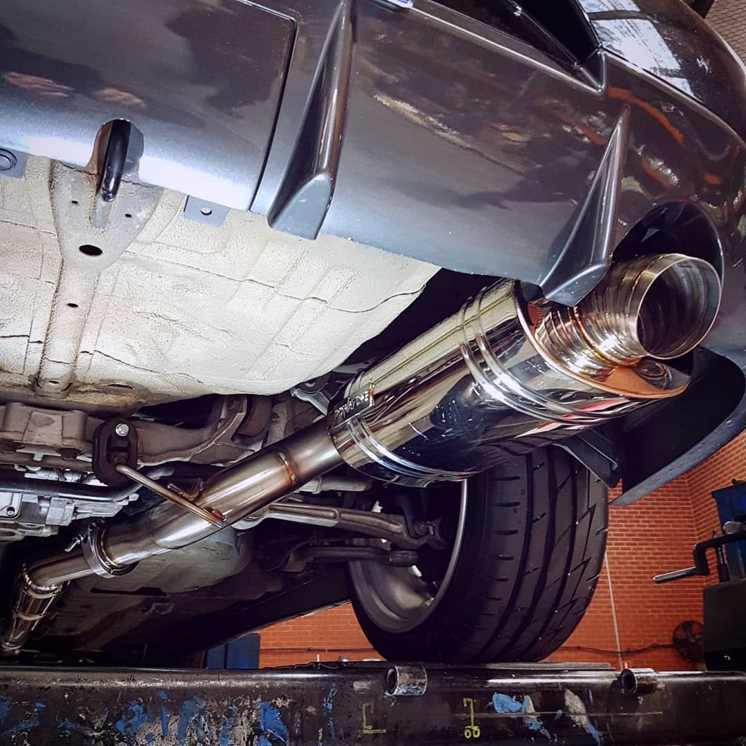 The Underside of a Car with a Stainless Steel Exhaust Pipe - Mechanic in Fyshwick, ACT