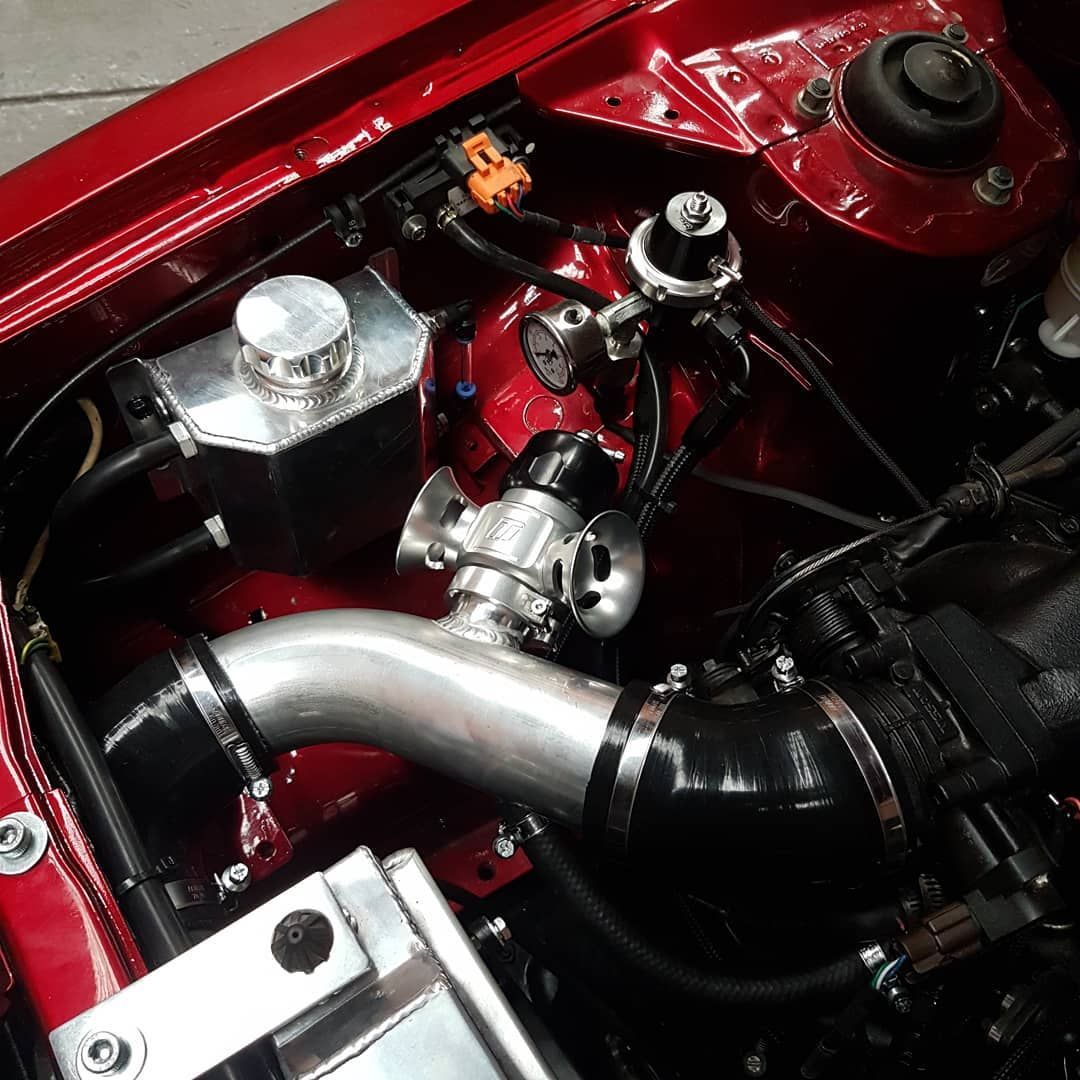 A Close Up Of The Engine Of A Red Car - Mechanic In Fyshwick, ACT