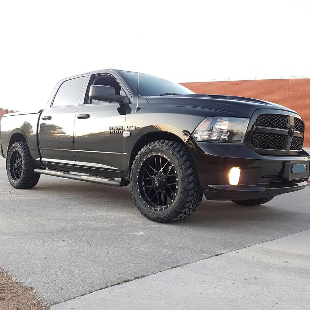 A Black 4x4 Truck Is Parked on The Side of The Road — Powatone Exhaust Centre in Fyshwick, ACT
