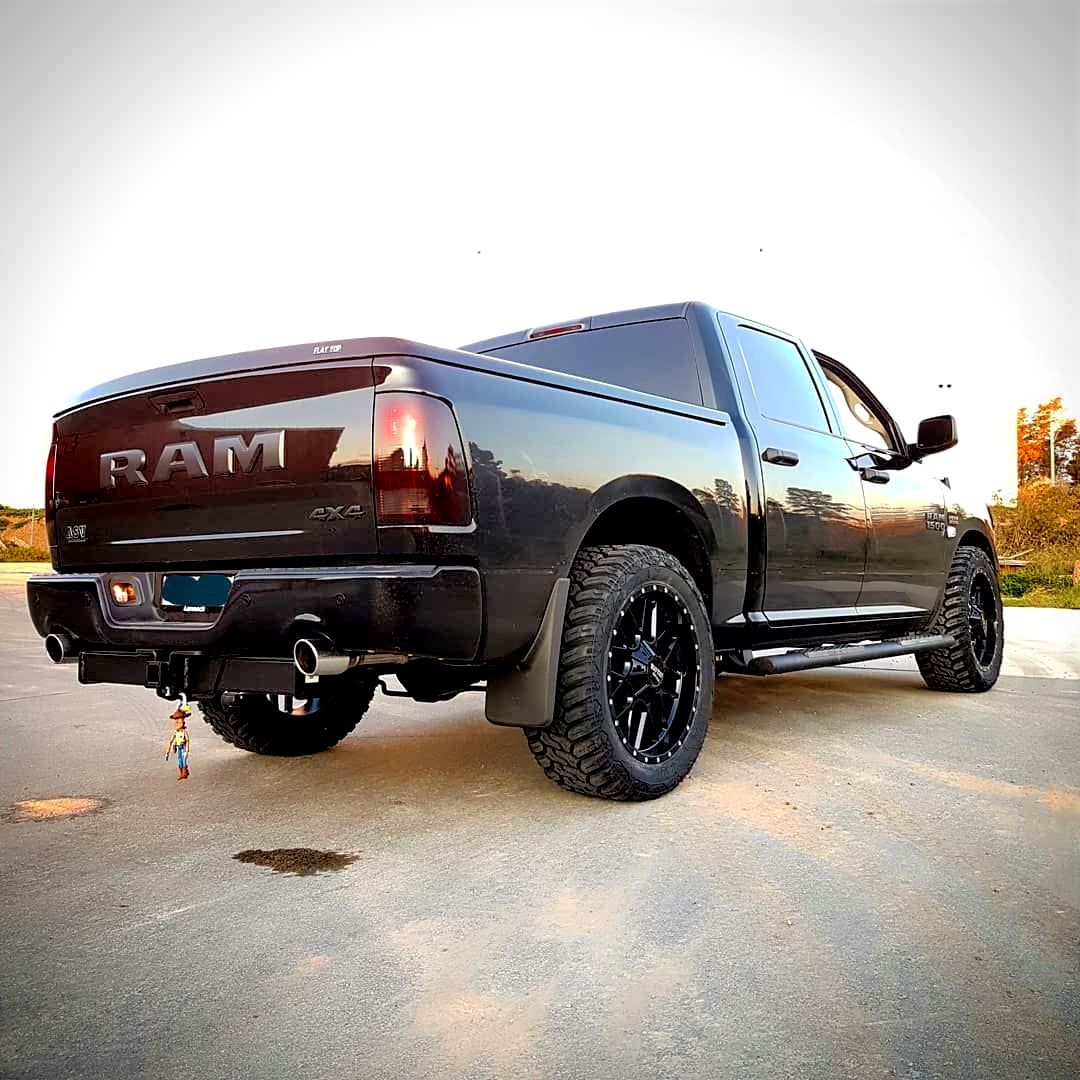 A Black Dodge Ram Truck Is Parked On The Side Of The Road - Mechanic In Fyshwick, ACT