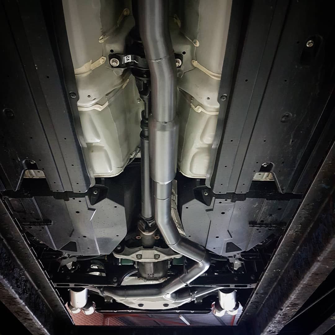 A Close Up Of The Underside Of A Car With An Exhaust Pipe - Mechanic In Fyshwick, ACT