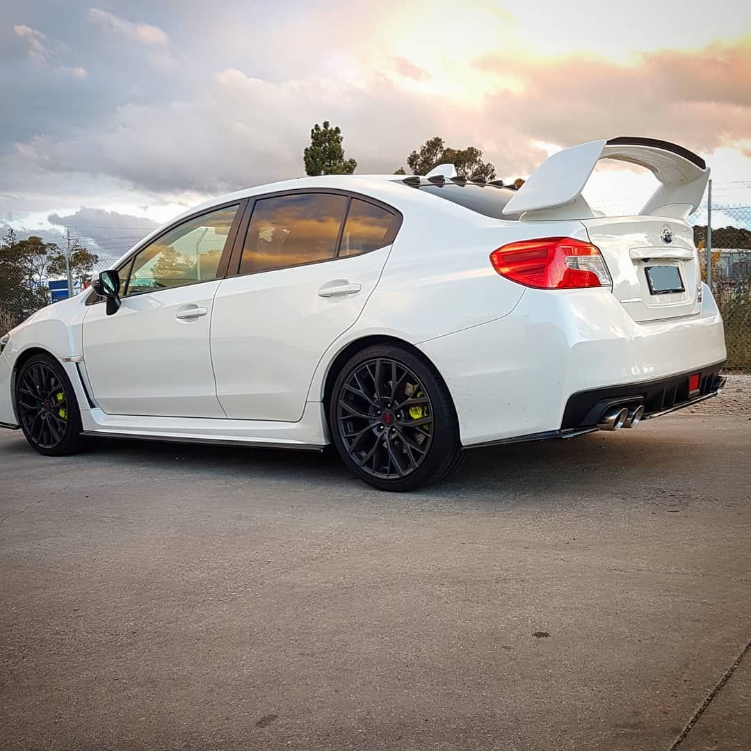 A White Subaru WRX STI Is Parked On The Side Of The Road - Mechanic In Fyshwick, ACT