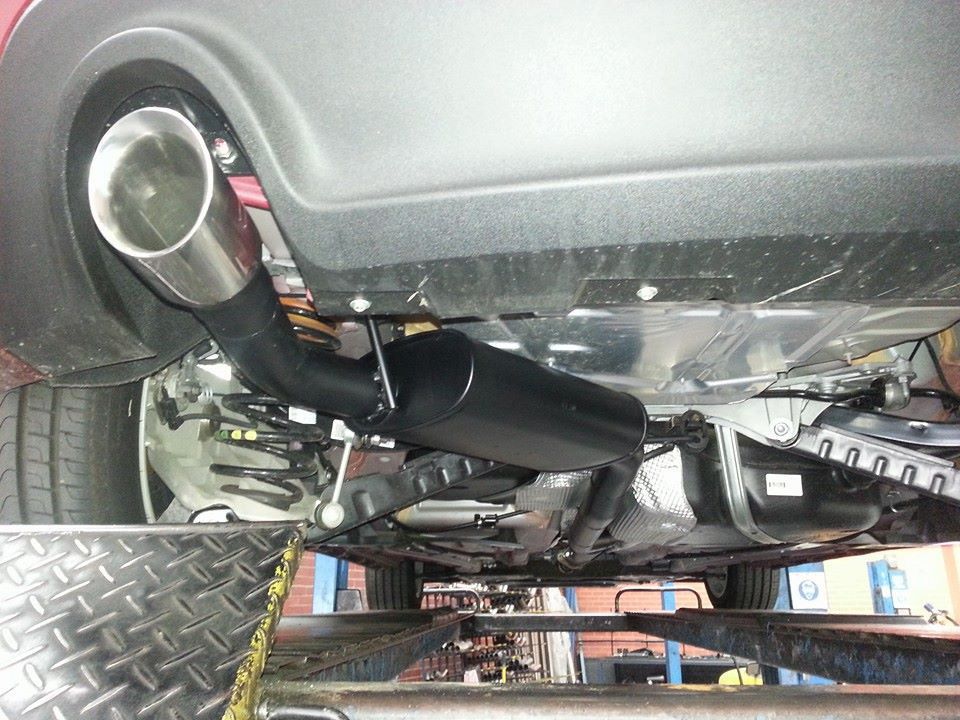 The Underside of A Car with A Exhaust Pipe Attached to It — Powatone Exhaust Centre in Fyshwick, ACT