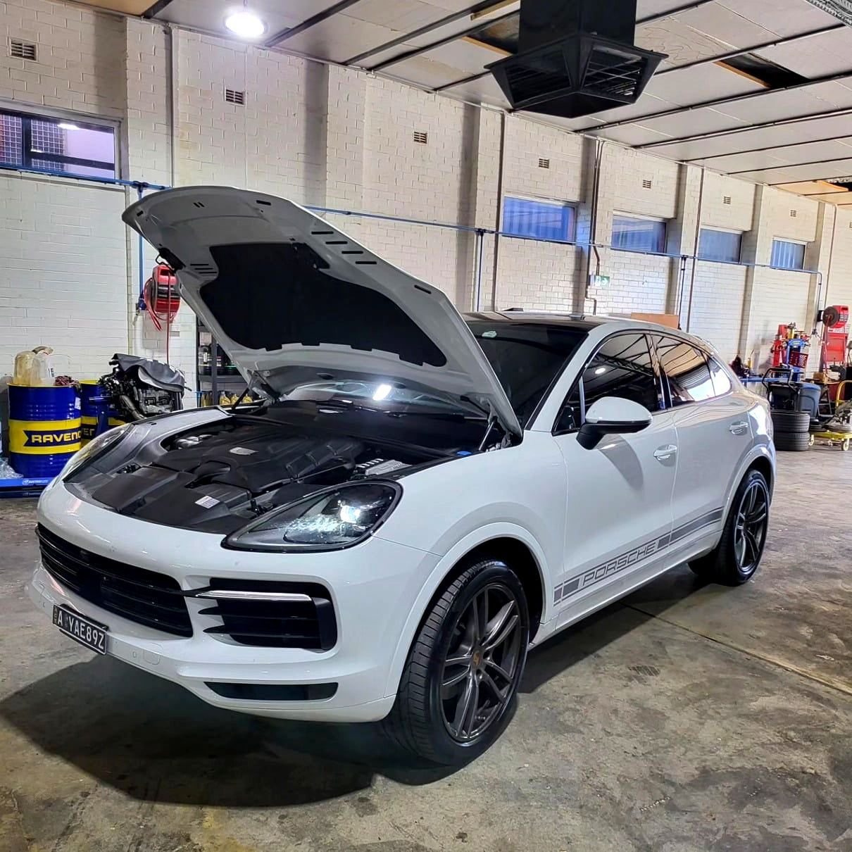 A Stainless Steel Pipe Is Sitting On A Table In Front Of A Sign That Says Powatone - Mechanic In Fyshwick, ACT