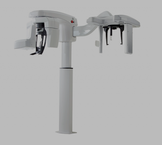Apparecchio radiografico panoramico dentale bianco con due guide di posizionamento della testa.