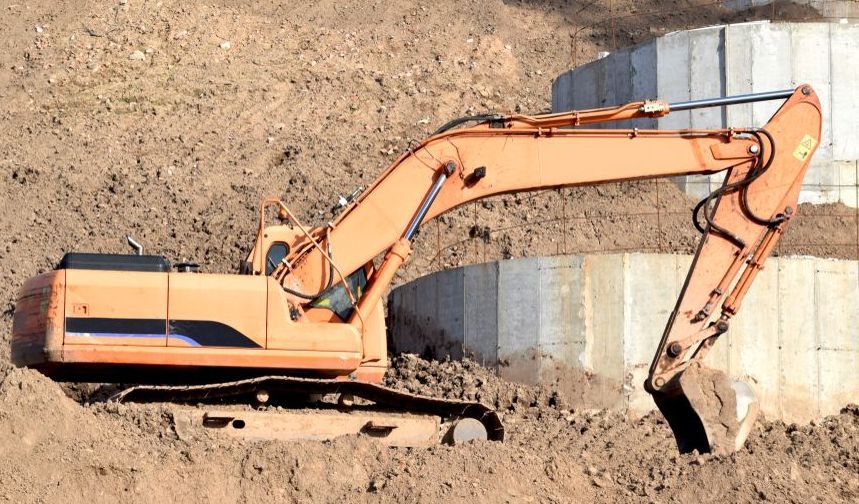 A Large Orange Excavator is Sitting on Top of a Dirt Field — Gears Excavation In Cedar Pocket, QLD