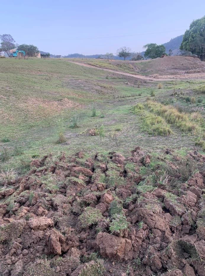 A Field of Dirt and Grass With a Dirt Road in the Background — Gears Excavation In Cedar Pocket, QLD