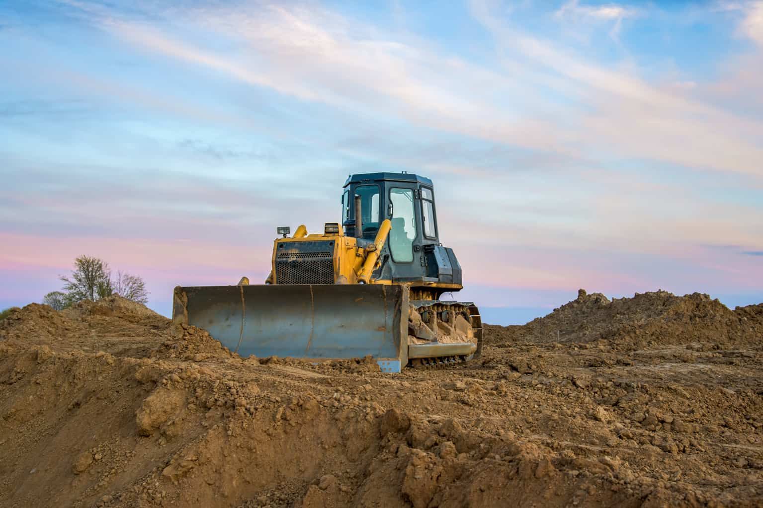 A Bulldozer is Moving Dirt on a Construction Site — Gears Excavation In Cedar Pocket, QLD