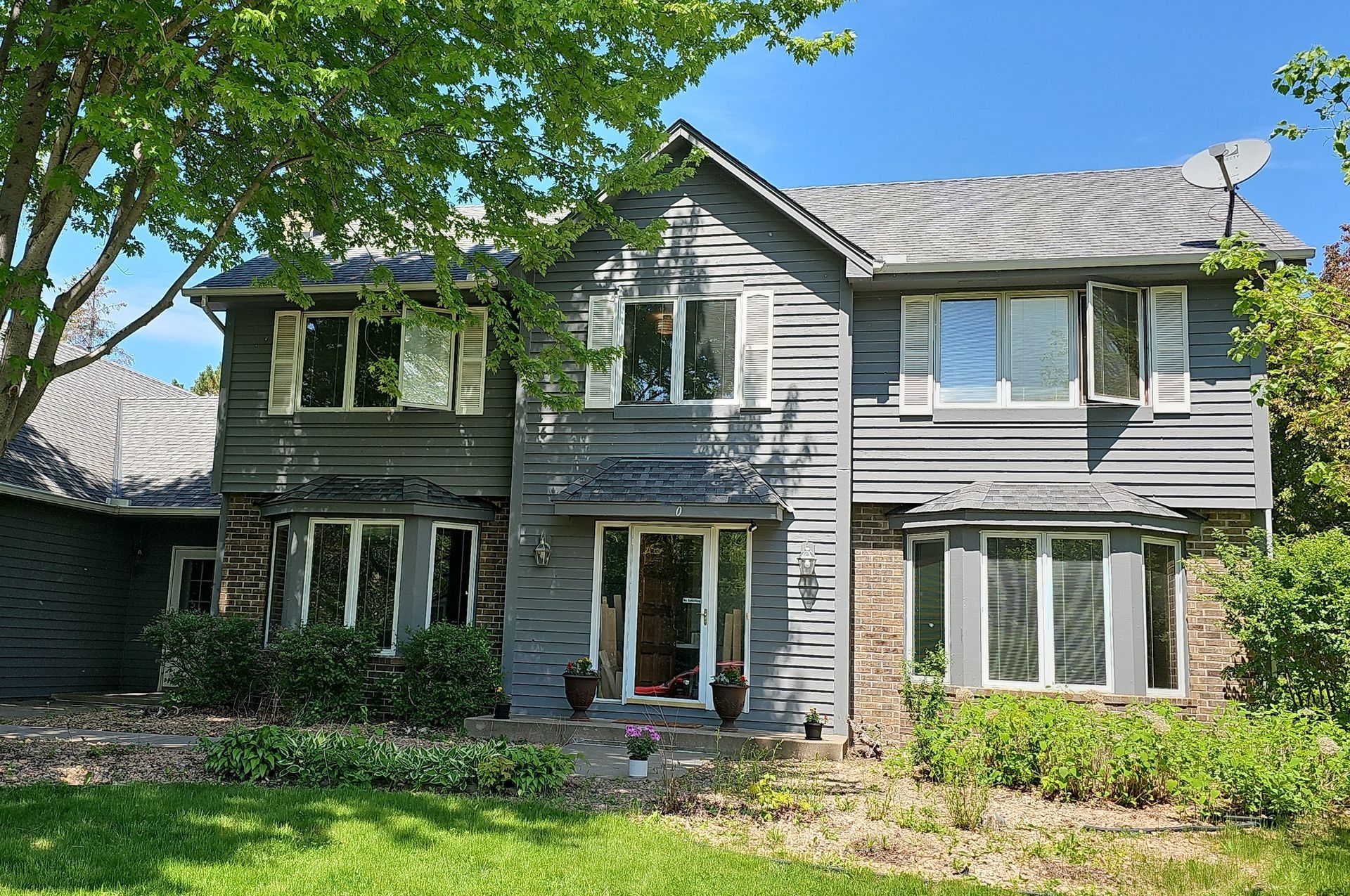 Blue House Before — Carver, MN — TJ Exteriors Inc.